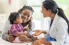 Doctor meeting with a mother and her son